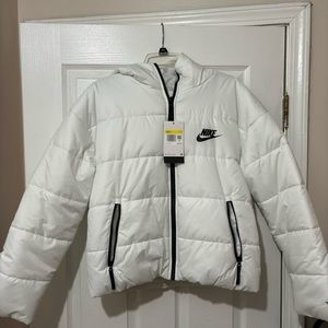 Brand new White Nike zip up puffer jacket. Women’s small